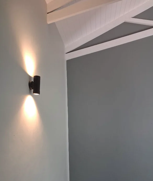 Commercial lighting fixtures illuminating a modern building interior